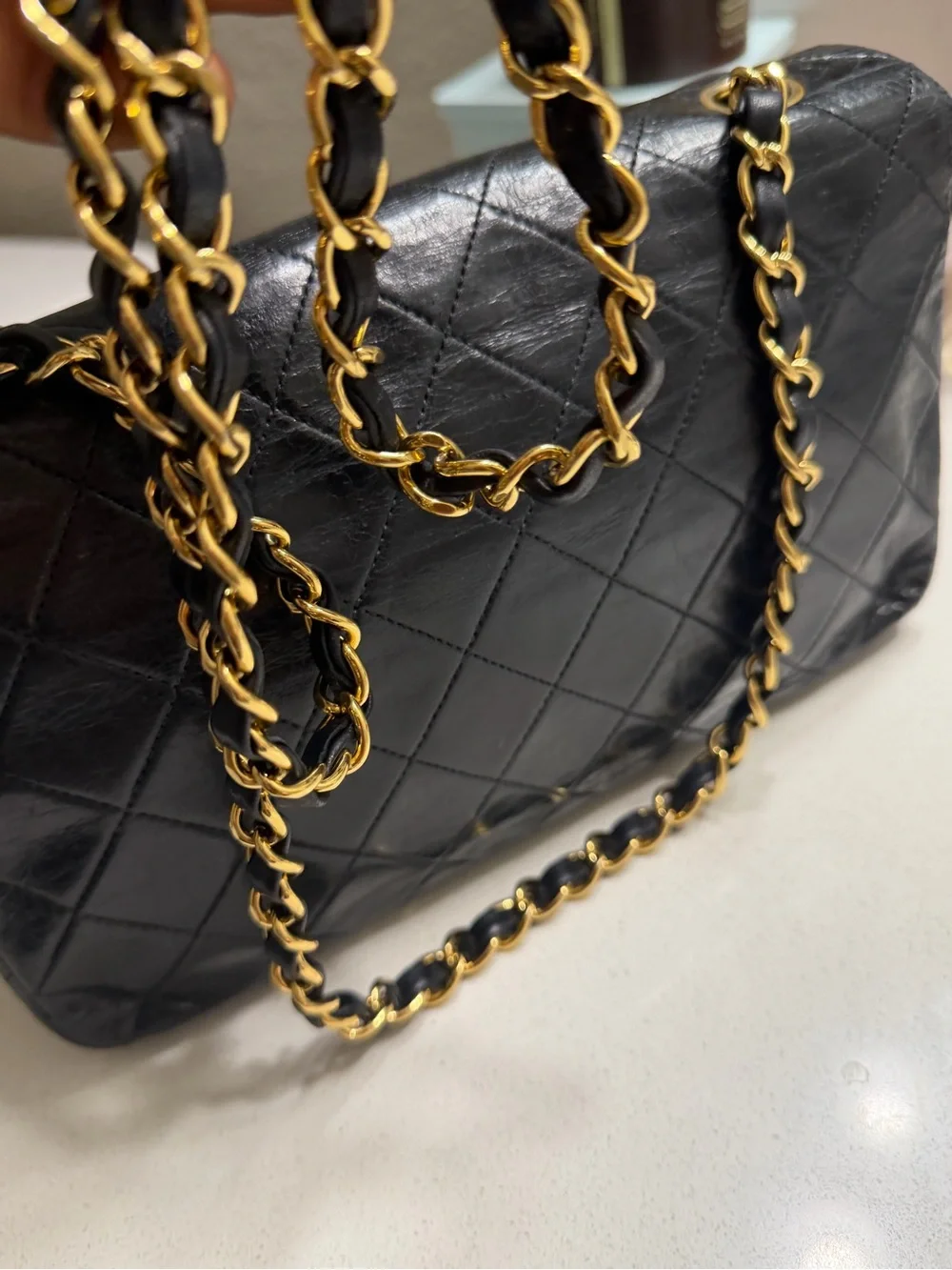 CHANEL Black Quilted Shoulder Bag with Gold CC Lock
